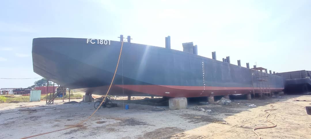 Newbuilding hull FC 1801 propped up in a shipyard