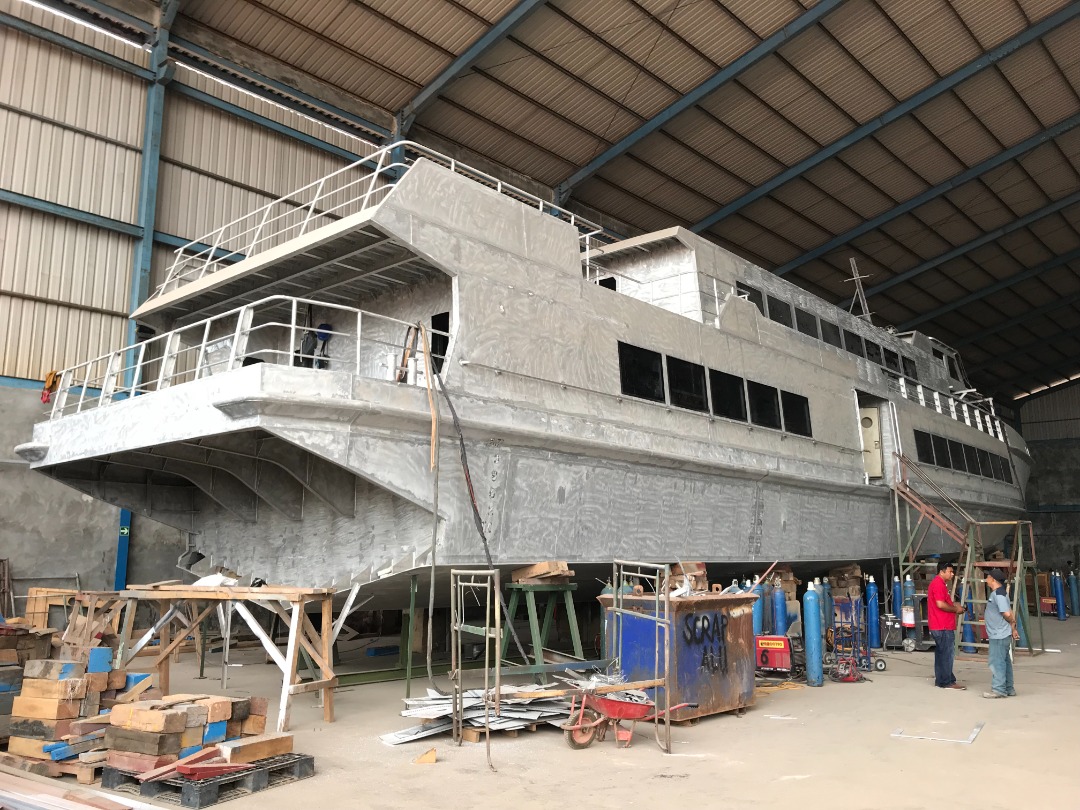 Newbuilding catamaran hull under construction in the shipyard