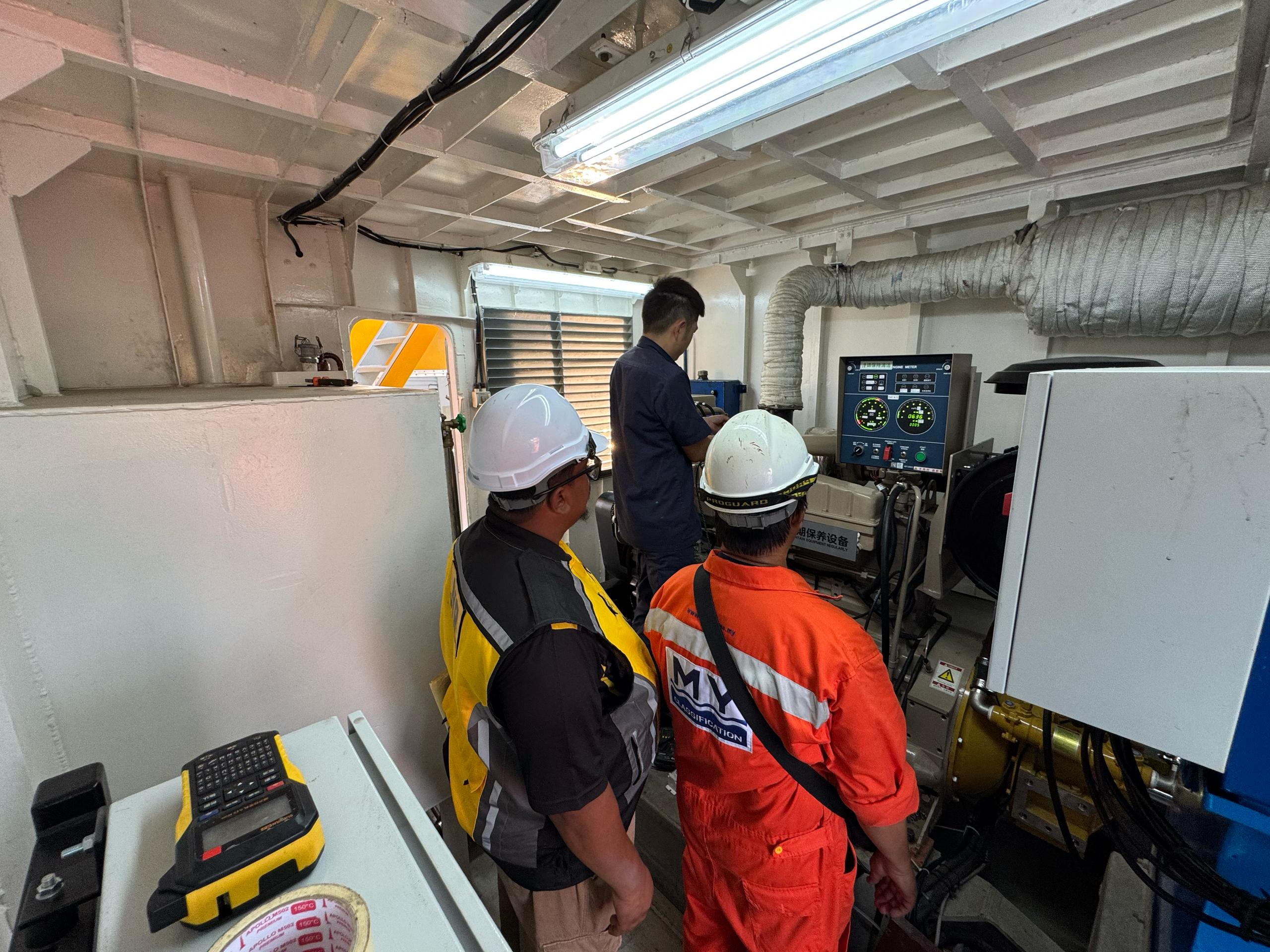 MY Classification surveyors at an approved facility